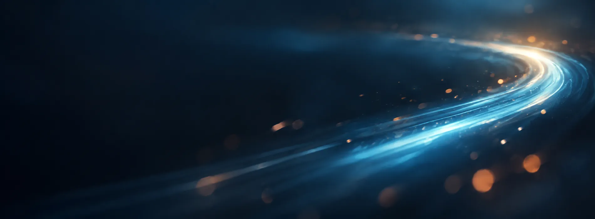 A curving blue light trail with orange sparks on a dark blue background