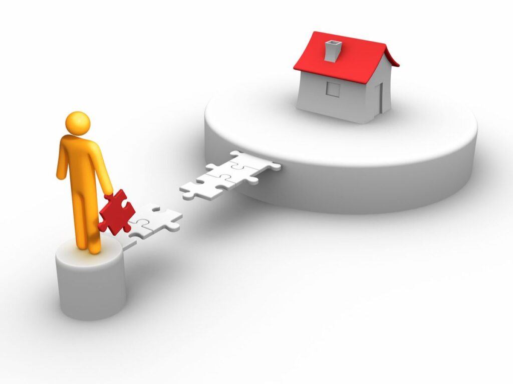 Orange figure places a red puzzle piece to connect a path to a small house on a pedestal, symbolizing building a home solution.