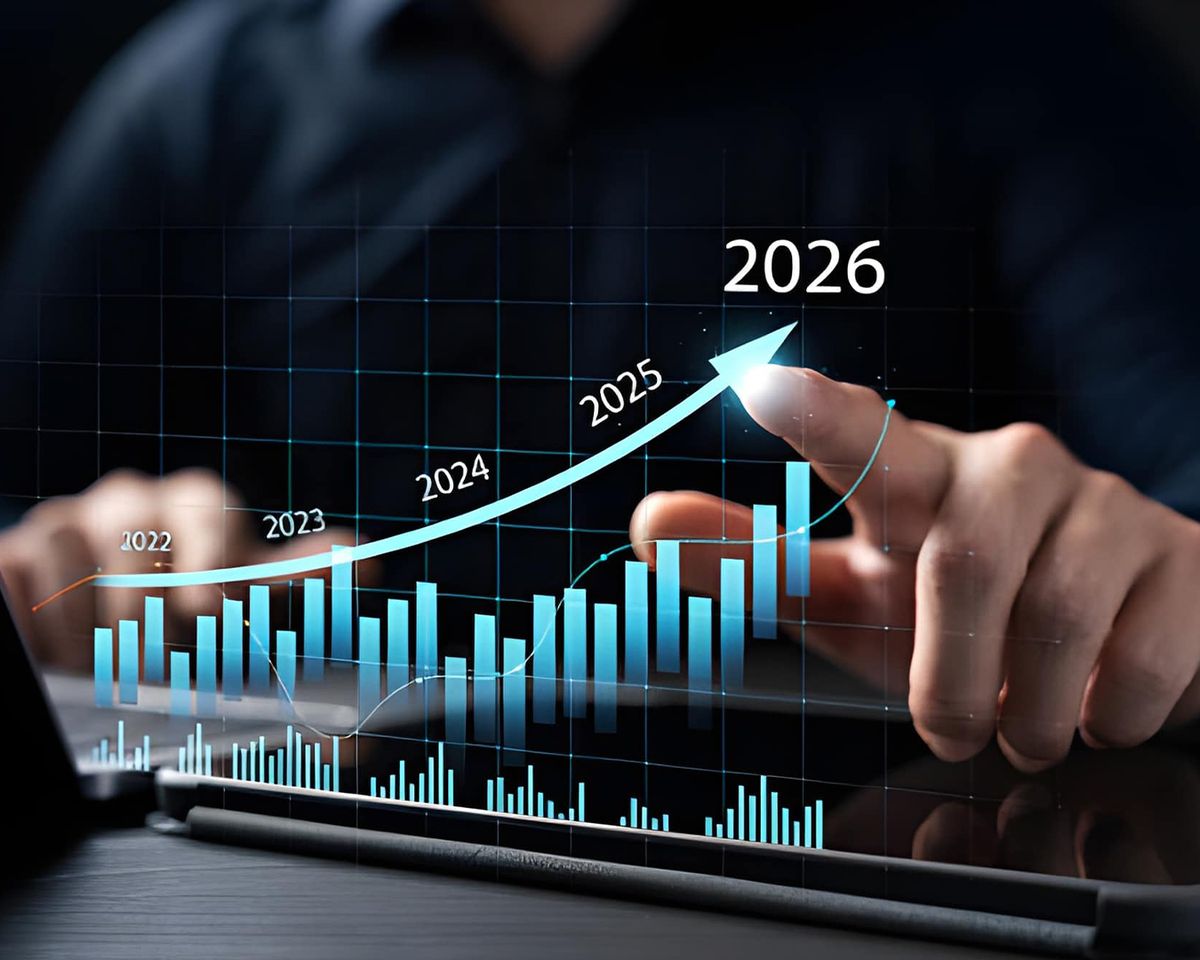 Upward-trending financial chart from 2022 to 2026 with blue bars and a rising arrow being pointed at by a finger.