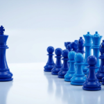 A single chess king piece facing a group of chess pieces representing in-house versus agency marketing