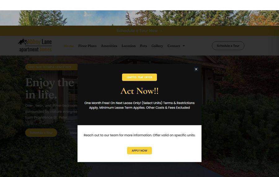 Homepage with a dark promotional modal reading Act Now!! over a scenic apartment site background.