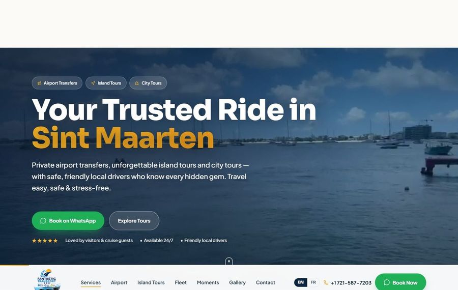 Hero banner with ocean backdrop and headline 'Your Trusted Ride in Sint Maarten' plus a green 'Book on WhatsApp' button and tour tags (Airport Transfers, Island Tours, City Tours).