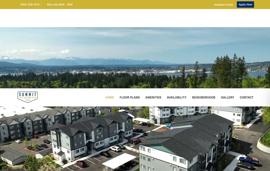 Aerial view of a mountain landscape behind a modern apartment complex; Summit Vista logo and navigation bar visible.